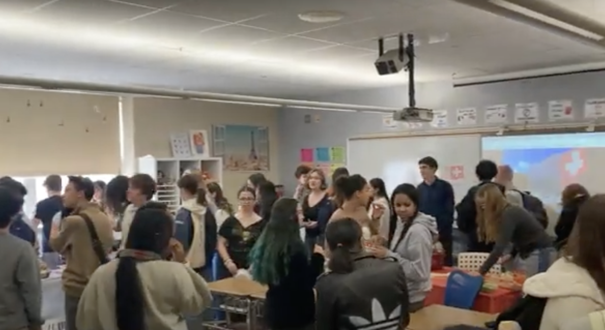 Students filled room 204 at the end of fourth block on January 30, trying to get a taste of the Swiss and German cuisine selections. (Screenshot)